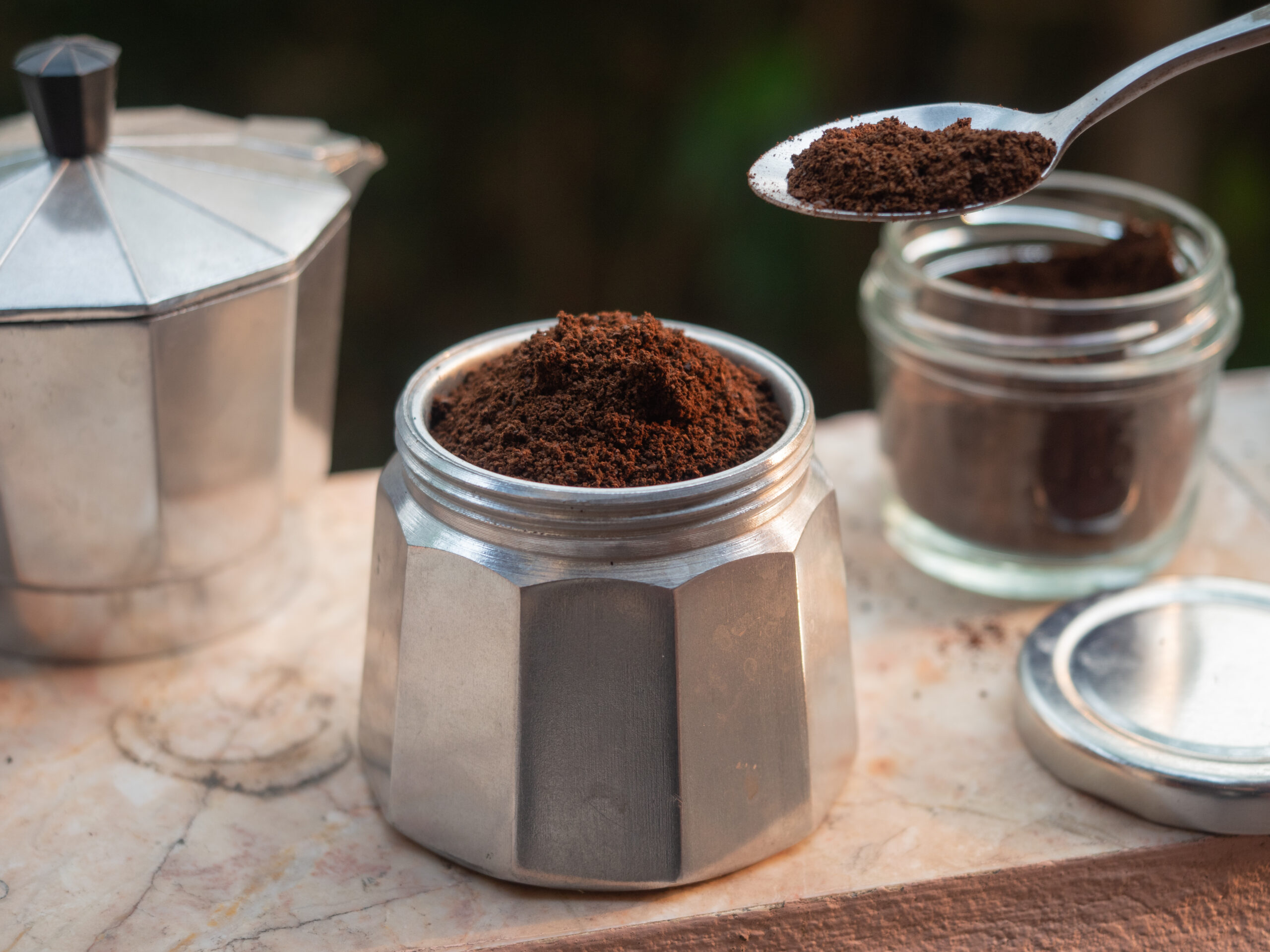 Adding ground coffee in moka pot